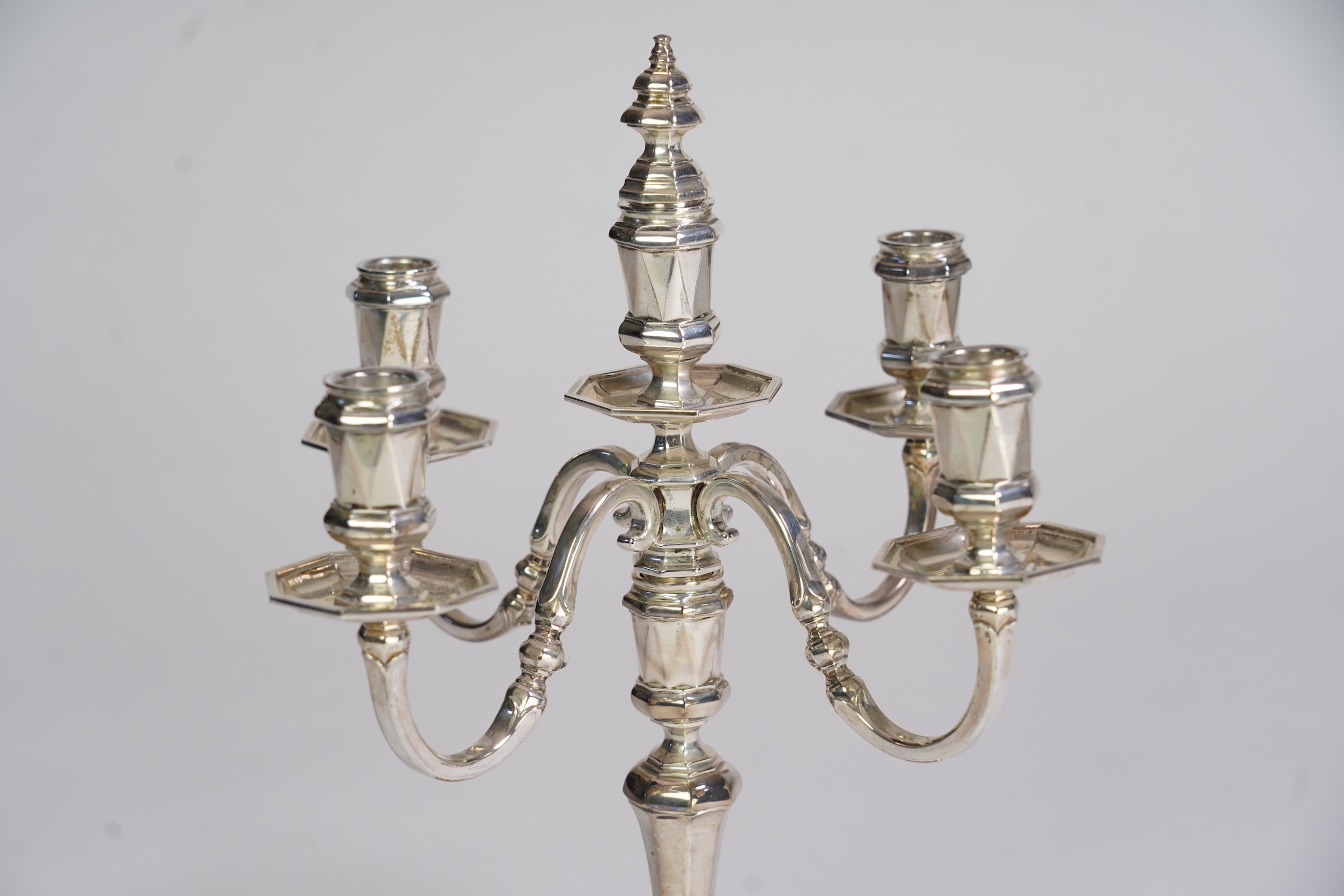 An Elizabeth II silver four branch, four light candelabrum by William Comyns & Sons Ltd